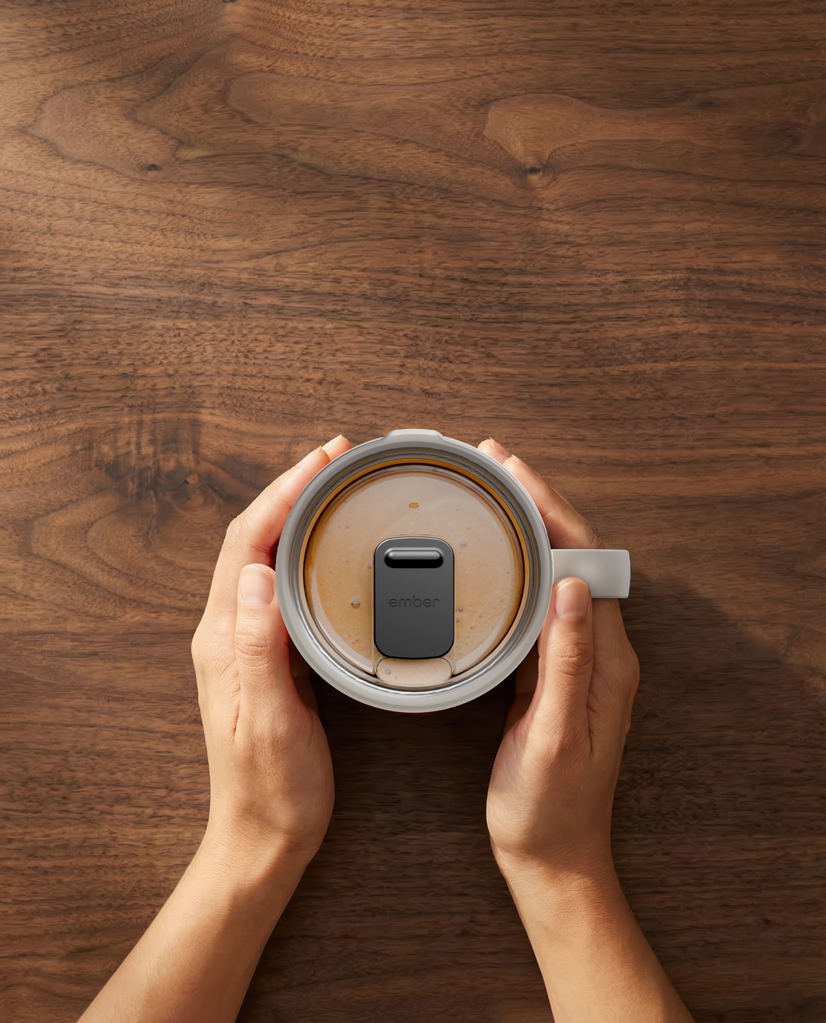 Ember Mug 3 in Sandstone, 14 oz, top-down with coffee